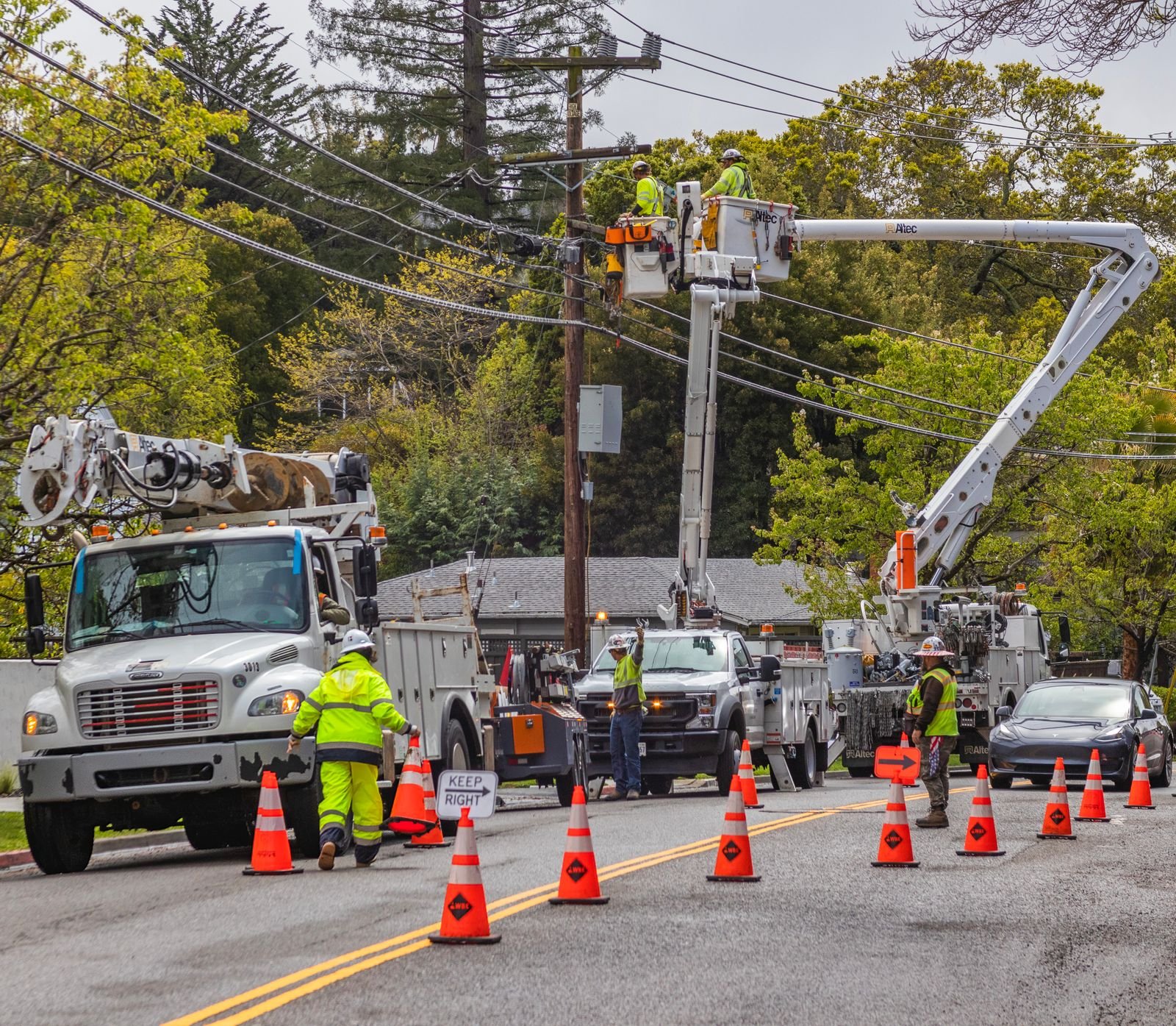 Utility line truck with bucket lift servicing power lines
